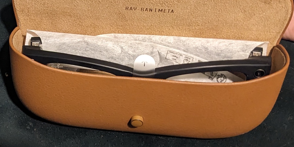 Meta Ray-Ban glasses in their open charging case.